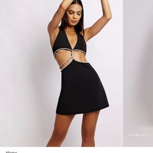 Meshki black sparkly mini dress with cutout.